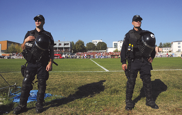 FK Tirana ultras storm pitch and attack officials after late