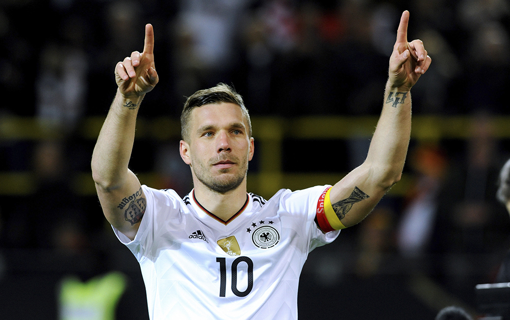 Stunning strike as Podolski signs off international career - World Soccer